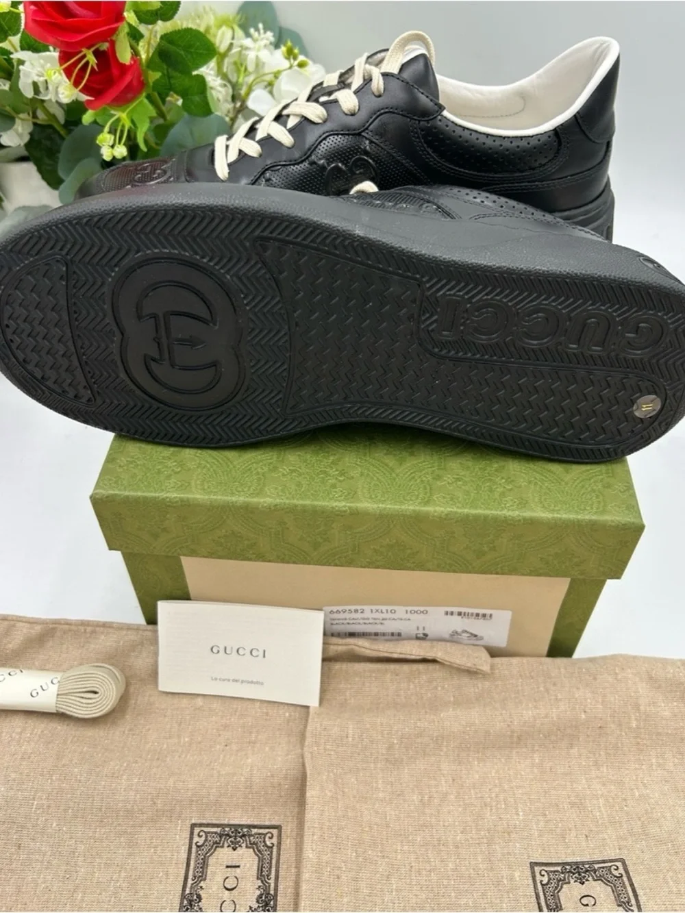 Gucci, GG embossed, black leather sneakers size 9.5 fits 10 made in Italy